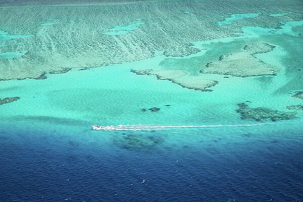 Aerial view of motorboat on the barrier reef, Fiji