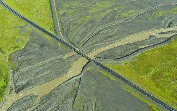 Aerial view of Ring Road No. 1 with a bridge crossing a tributary of the Skaftafellsa glacial river, Southern Region, Iceland
