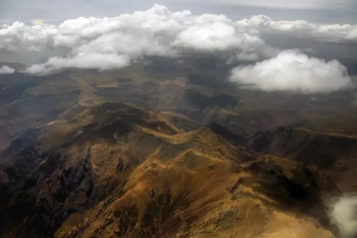 Framed Print : Aerial view of Semien mountains touching clouds