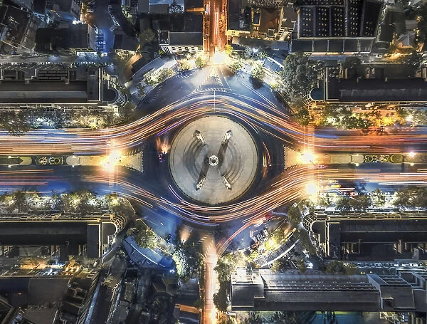 aerial top view traffic circle with speed light in city at night, Democracy Monument, bangkok, thailand