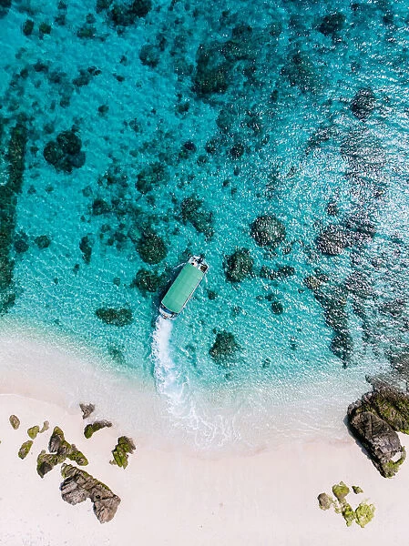 Aerial view of tropical beach and boat on clear water, Kerama Islands, Okinawa, Japan