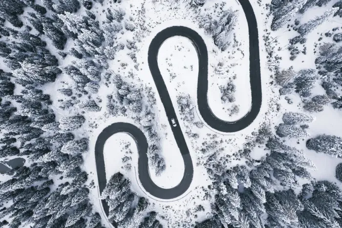 Framed Print : Aerial view of winding road in winter forest Framed Print : Aerial view of winding road in winter forest