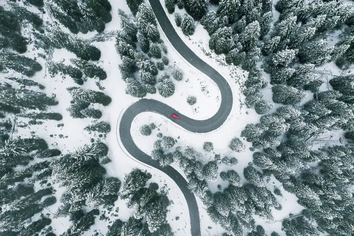 Framed Print : Aerial view of winding road in winter forest Framed Print : Aerial view of winding road in winter forest