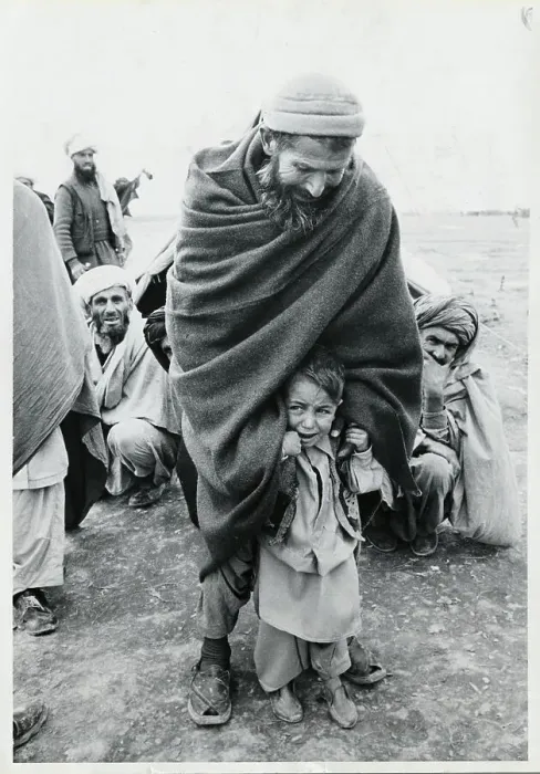 Framed Print : Afghan Man Protecting a Crying Child