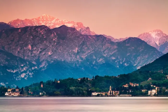 Framed Print : Afterglow. Sunset illuminates top of mountain overlooking village in Lake Como, Italy Framed Print : Afterglow. Sunset illuminates top of mountain overlooking village in Lake Como, Italy