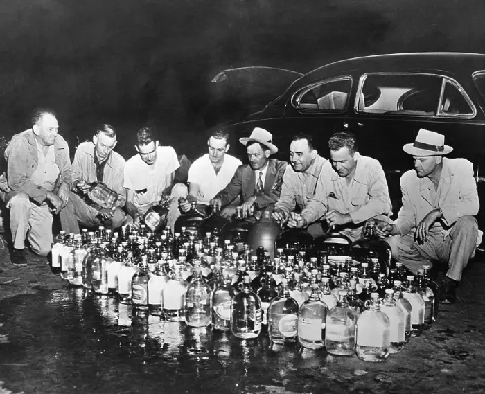 Framed Print : Agents Examining Bottle of Moonshine Framed Print : Agents Examining Bottle of Moonshine