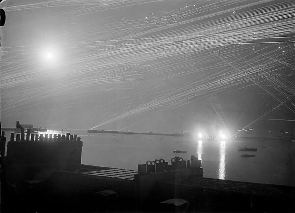 Air Raid. May 1940: Long exposure taken of coastal defences during a night