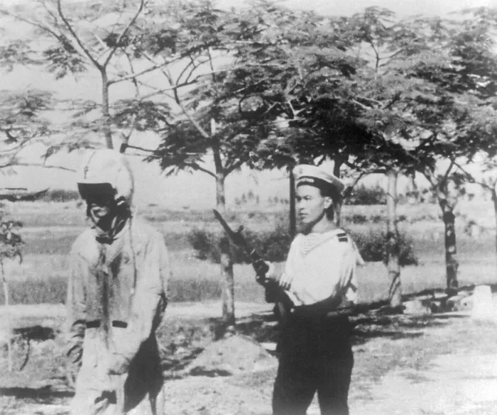 Framed Print : US Airman Being Led By North Vietnamese Sailor with Gun Framed Print : US Airman Being Led By North Vietnamese Sailor with Gun