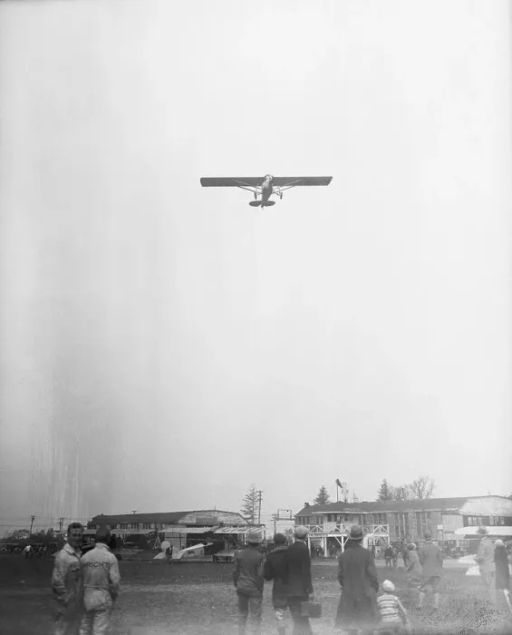 Framed Print : Airplane Being Observed Over Airfield Framed Print : Airplane Being Observed Over Airfield