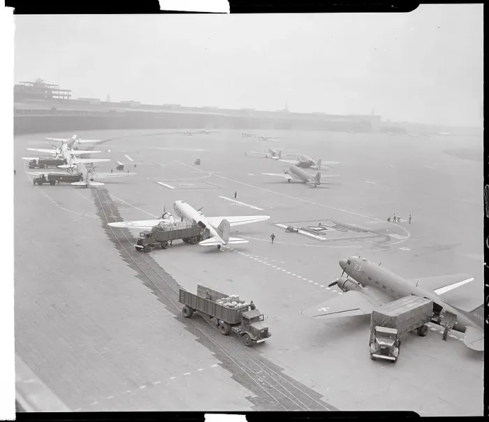 Framed Print : Airplanes and Trucks on Runway Framed Print : Airplanes and Trucks on Runway