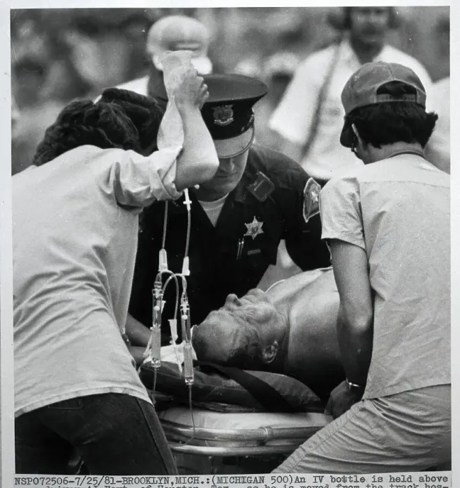 Framed Print : A.J. Foyt Being Moved on Gurney at Track Framed Print : A.J. Foyt Being Moved on Gurney at Track