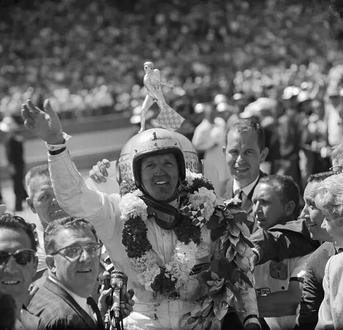 Framed Print : A.J. Foyt Waving With Garland of Flowers Framed Print : A.J. Foyt Waving With Garland of Flowers