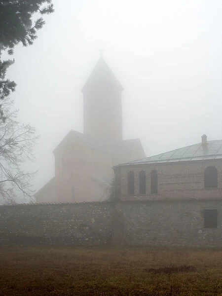 Akhali Shuamta monastery in fog, Kakheti region, Georgia