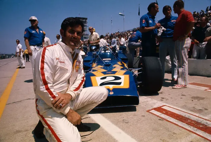 Framed Print : Al Unser Kneeling Beside Racing Car Framed Print : Al Unser Kneeling Beside Racing Car