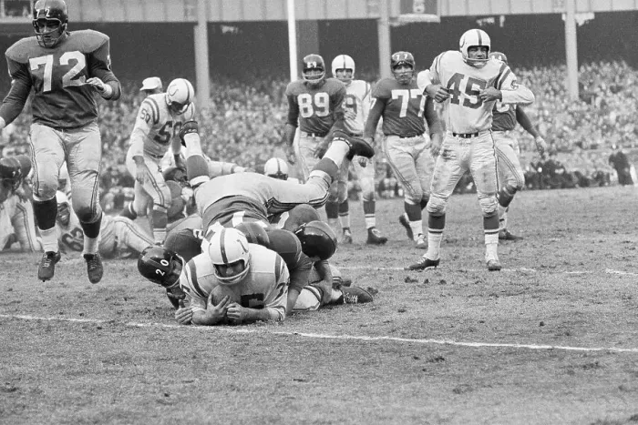 Framed Print : Alan Ameche Being Tackled by New York Defenders Framed Print : Alan Ameche Being Tackled by New York Defenders