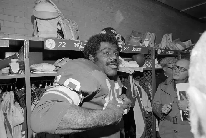 Framed Print : Alan Page Dressing in Locker Room Framed Print : Alan Page Dressing in Locker Room