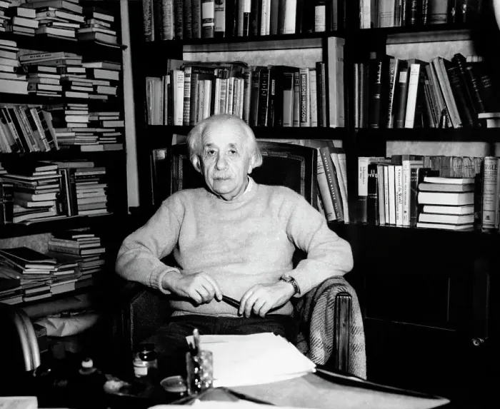 Framed Print : Albert Einstein Seated in Front of Bookcase Framed Print : Albert Einstein Seated in Front of Bookcase
