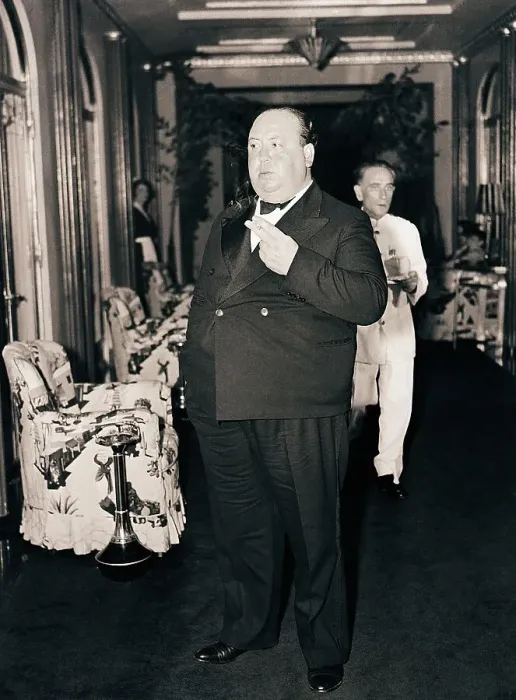 Framed Print : Alfred Hitchcock Smokes in Hallway Framed Print : Alfred Hitchcock Smokes in Hallway