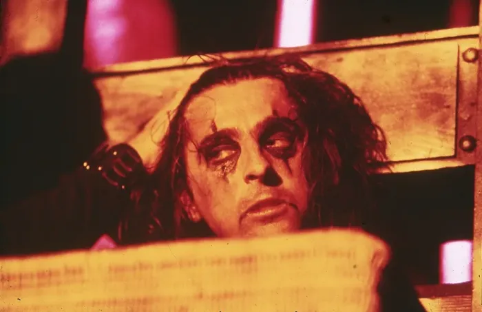 Framed Print : Alice Cooper with his head in a guillotine Framed Print : Alice Cooper with his head in a guillotine
