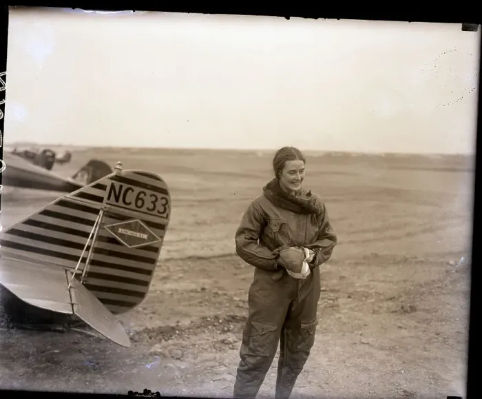 Framed Print : Alicia Patterson Stands Behind Biplane Framed Print : Alicia Patterson Stands Behind Biplane