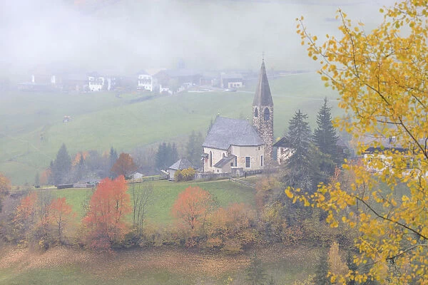 Alpine church at fall St. Magdalena Funes Valley