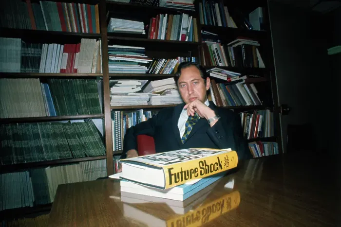 Framed Print : Alvin Toffler Posing at Desk
