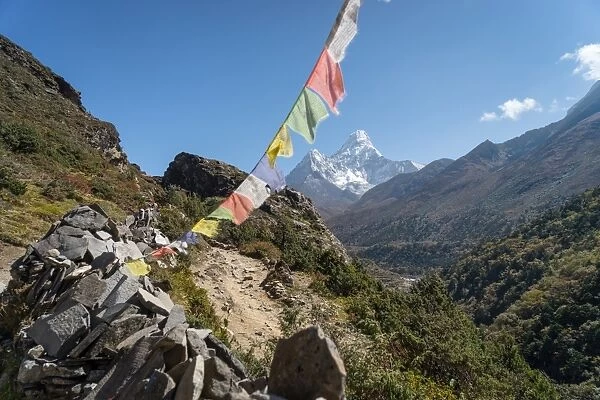 Ama Dablam mountain peak and prayer flag, Everest region