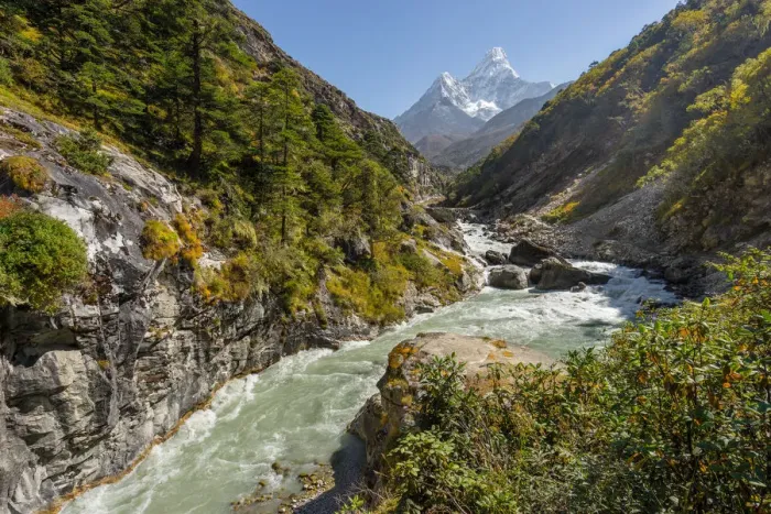 Framed Print : Ama Dablam mountain peak and small river, Everest region