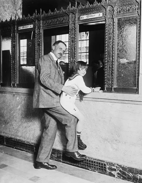 Framed Print : Amadeo Peter Giannini Lifting Jackie Coogan to Teller's Window Framed Print : Amadeo Peter Giannini Lifting Jackie Coogan to Teller's Window