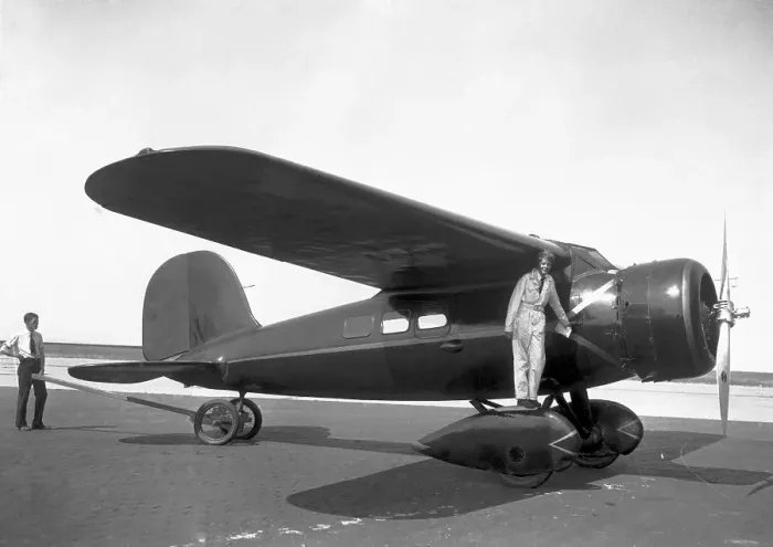 Framed Print : Amelia Earhardt Posing with Airplane Framed Print : Amelia Earhardt Posing with Airplane