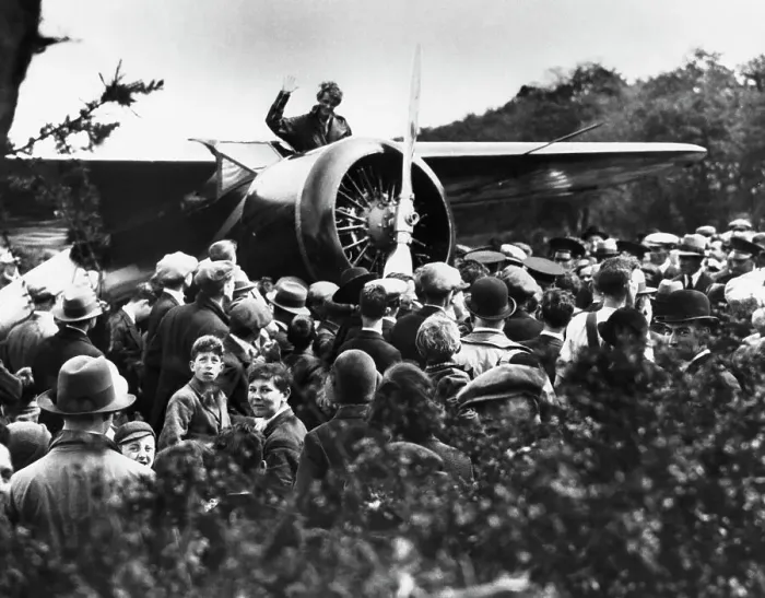 Framed Print : Amelia Earhart Acknowledging Fans from Her Airplane