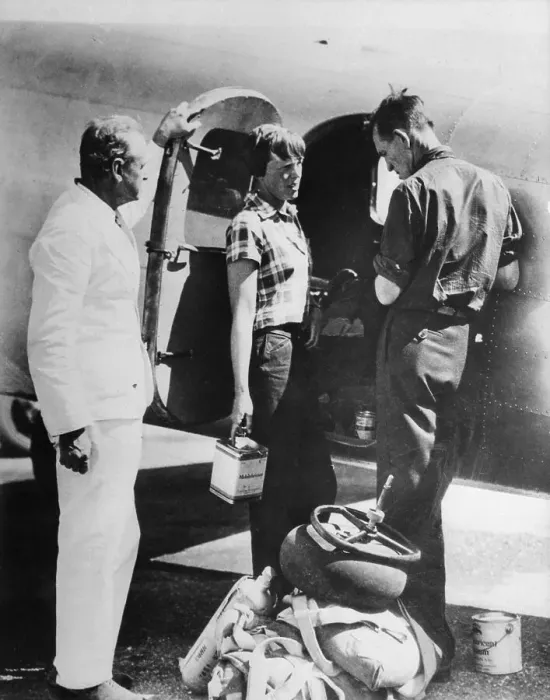 Framed Print : Amelia Earhart and Fred Noonan Standing by Airplane Framed Print : Amelia Earhart and Fred Noonan Standing by Airplane