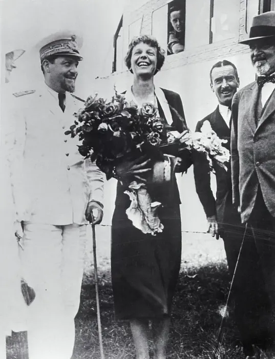 Framed Print : Amelia Earhart Holding Flowers Framed Print : Amelia Earhart Holding Flowers