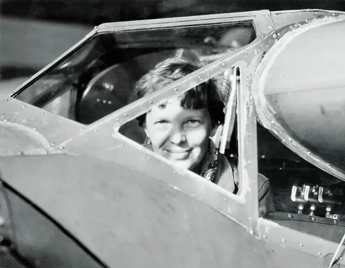 Framed Print : Amelia Earhart Peering out from Airplane