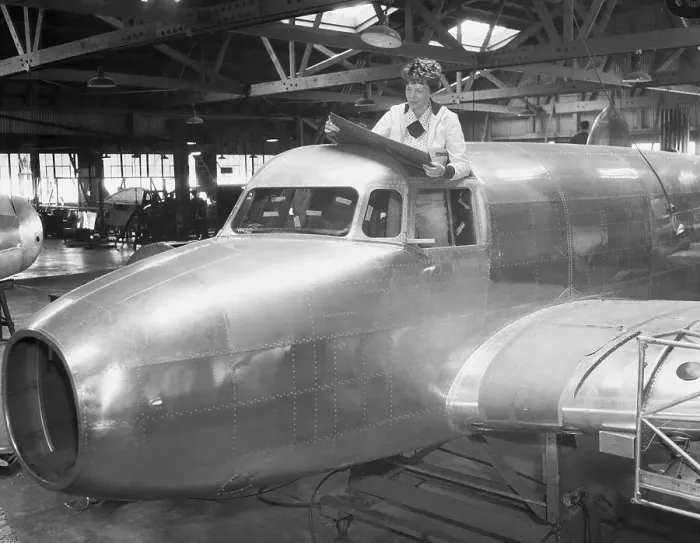 Framed Print : Amelia Earhart Reading Blueprints in Cockpit Framed Print : Amelia Earhart Reading Blueprints in Cockpit