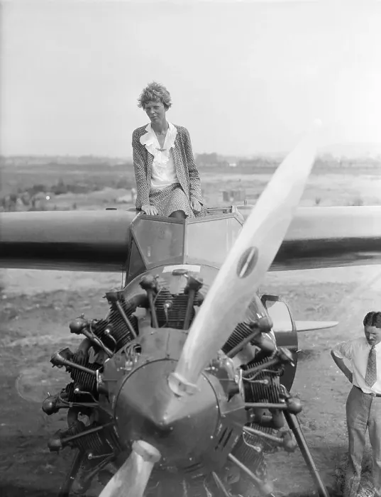 Framed Print : Amelia Earhart Sitting Atop Airplane Framed Print : Amelia Earhart Sitting Atop Airplane