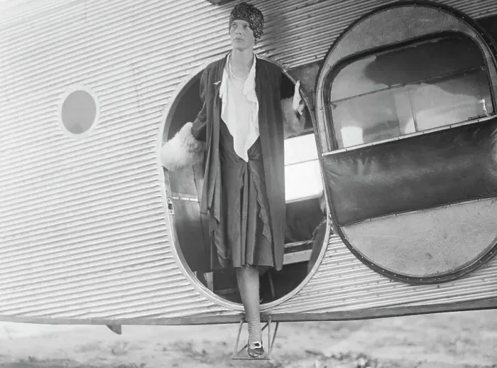 Framed Print : Amelia Earhart Standing in Airplane Doorway Framed Print : Amelia Earhart Standing in Airplane Doorway