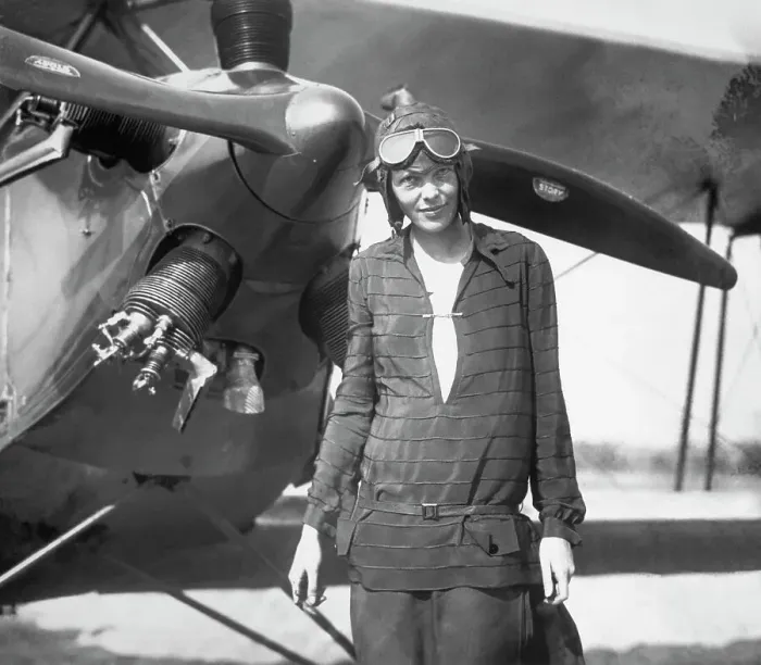 Framed Print : Amelia Earhart Stands In Front of Plane Framed Print : Amelia Earhart Stands In Front of Plane