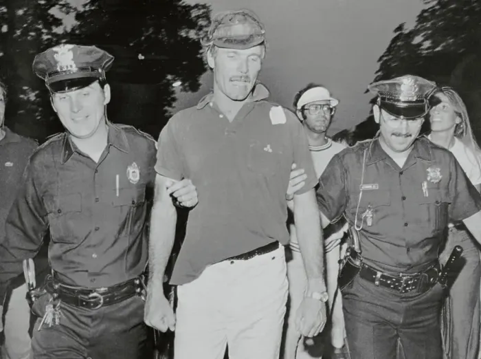 Framed Print : American Cup Winner Ted Turner Being Escorted by Policemen Framed Print : American Cup Winner Ted Turner Being Escorted by Policemen
