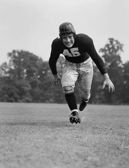 Framed Print : American football player running for tackle Framed Print : American football player running for tackle
