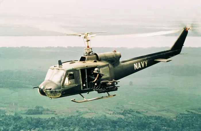 Framed Print : American Gunners Firing from Helicopter in Vietnam