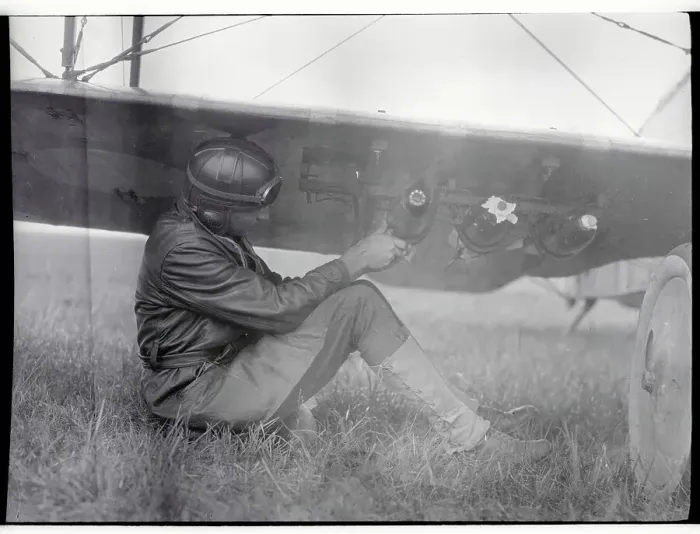 Framed Print : American Pilot Attaching Bombs to Plane Framed Print : American Pilot Attaching Bombs to Plane