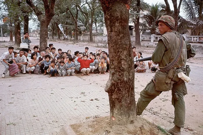 Framed Print : American Soldier Guards Refugees in Vietnam Framed Print : American Soldier Guards Refugees in Vietnam