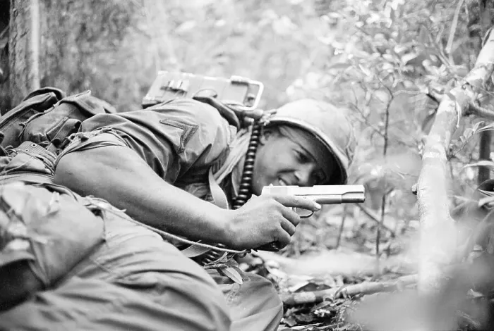 Framed Print : American Soldier Taking Cover with a Weapon