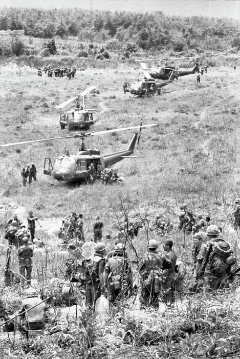 Framed Print : American Soldiers Alighting from Helicopters in Vietnam Field