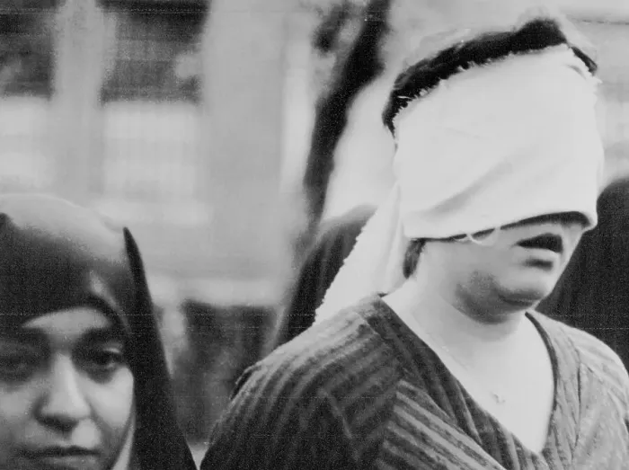 Framed Print : American Woman Hostage Being Led Framed Print : American Woman Hostage Being Led