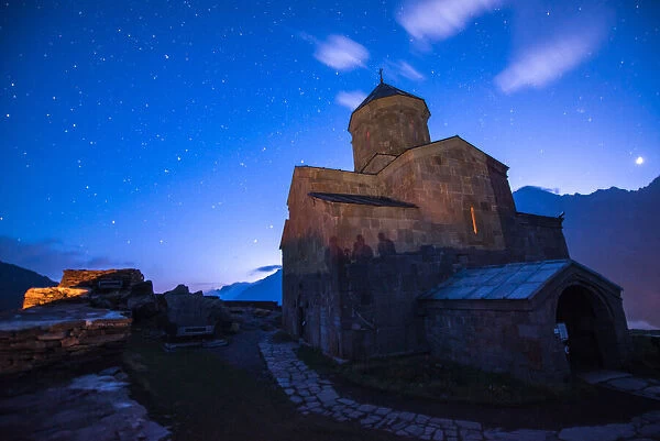 Ancient Gergeti Trinity Church high in the mountains