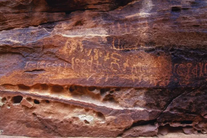 Framed Print : Ancient Nabatean Petroglyphs rock engravings in Wadi Rum desert Jordan