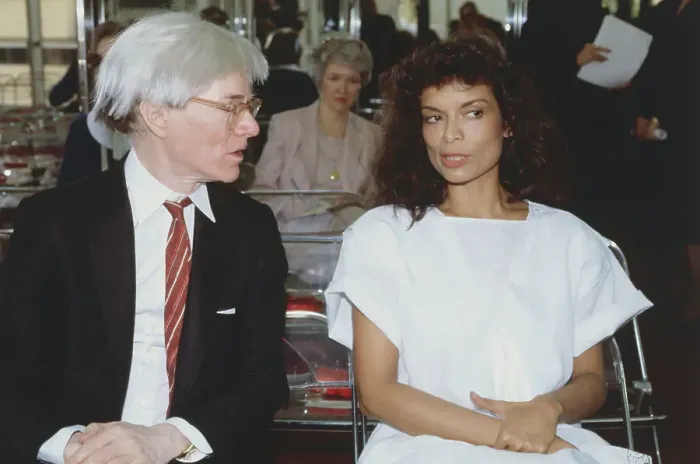 Framed Print : Andy Warhol and Bianca Jagger Talking Framed Print : Andy Warhol and Bianca Jagger Talking