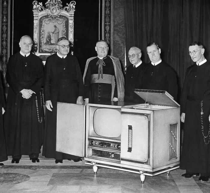 Framed Print : Angello Dell Acqua Inspecting a Television